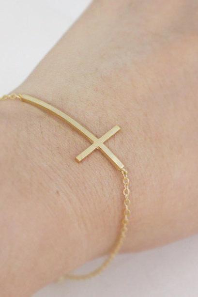 Sideways cross bracelet in gold, long sideways cross pendant