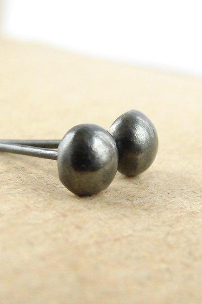 Small silver studs . Black oxidized sterling silver pebbles