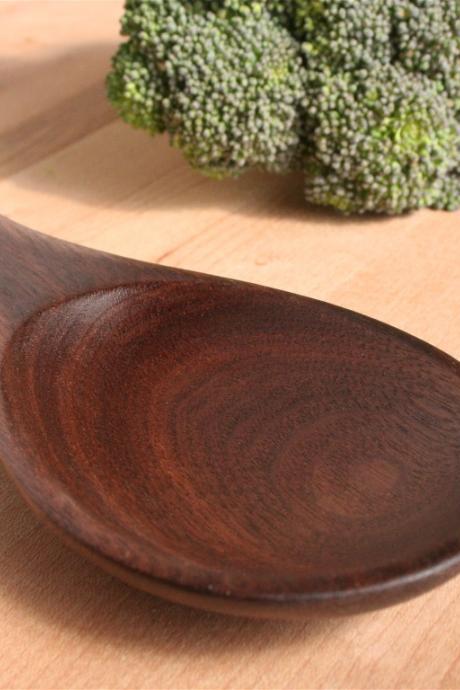 Wooden kitchen utensil stirring and tasting spoon of Black Walnut wood