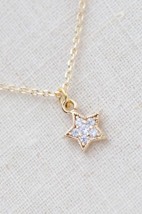 Tiny rhinestone star necklace in gold