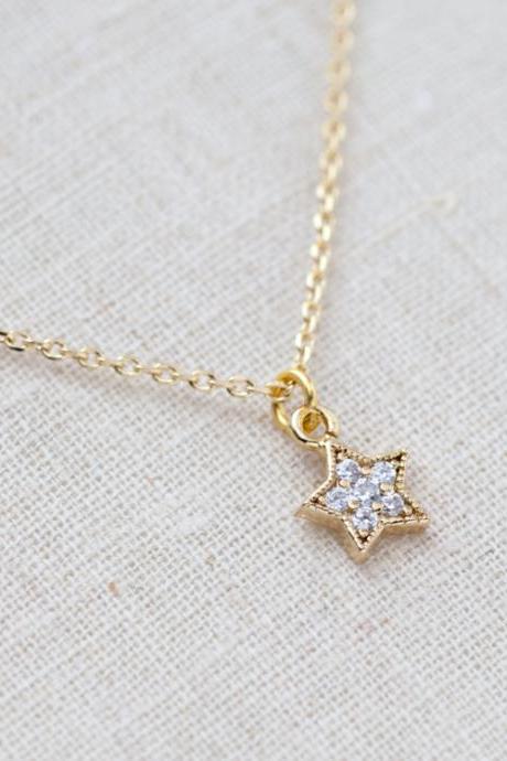Tiny rhinestone star necklace in gold
