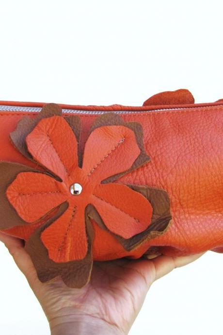 Medium sized orange Leather Clutch with flower applique on both sides