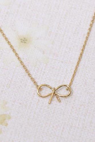 Tiny bow necklace in gold