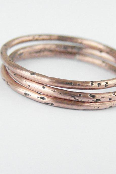 Minimalist copper stacking rings. Set of three simple bands.
